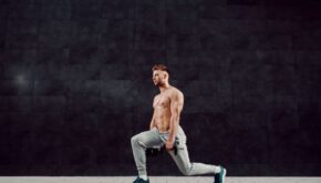 Man performing a single dumbbell reverse lunge